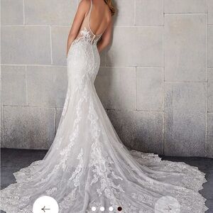 Madeline Gardner Elegant White Lace Bridal Gown.